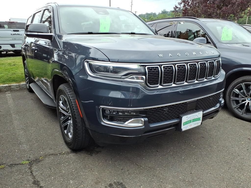 2023 Jeep Wagoneer ATMOSPHERE / BROWNSTONE in White Frost Tricoat — front three-quarter view