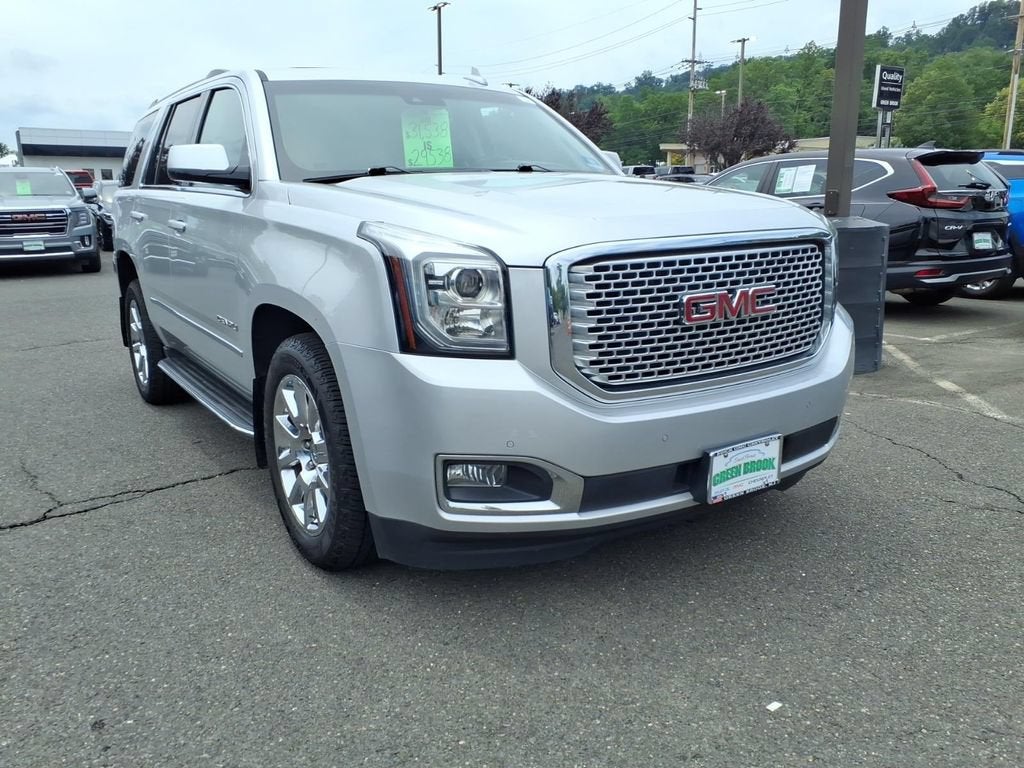 2017 GMC Yukon Denali in Quicksilver Metallic — front three-quarter view