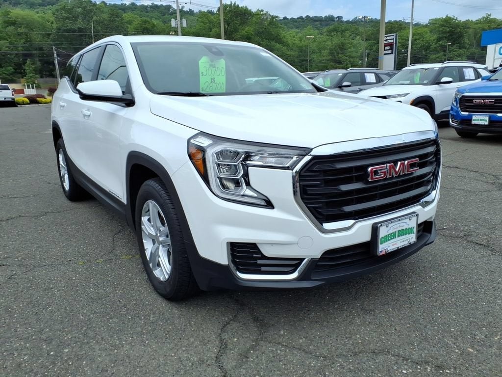 2024 GMC Terrain SLE in Summit White — front three-quarter view